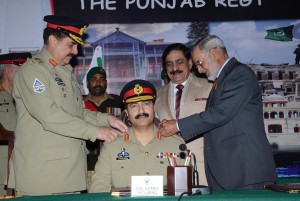 COAS, Gen Raheel Sharif pinning the badges of rank, Col Commandant of Punjab Regiment to Lt. Gen Shahid Baig Mirza, Military Secretary at Punjab Regiment Centre in Mardan on Tuesday. - DNA