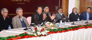 Chairman PTI, Imran Khan addressing a gathering of PTI parliamentarians from across the country in Islamabad on Tuesday. CM KP Pervez Khattak is also present.