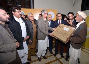 Chief Minister KPK Pervez Khattak distributing Solar Kits amongst the residents of Piran Bala Noshera at CM House in Peshawr.