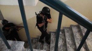 Members of Elite Police Force conduting mock security drill to meet any emergency situation in the educational institutions, at APS Westridge in Rawalpindi on Sunday.