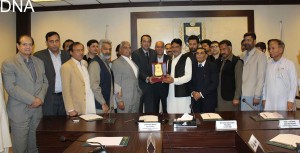 Atif Ikram Sheikh, President ICCI presents a shield to Ch Zafar Iqbal Gujar, President Traders Welfare Association, I&T Centre, G-10/4 Marekt during his visit to Chamber House in Islamabad on Tuesday.-DNA