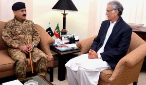 CM KP Pervez Khattak talking to Gen Hidayatur Rehman, Commander 11 Corps in Peshawar. - NNI