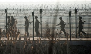 North Korean troops are patrolling along the border fence near Dandog
