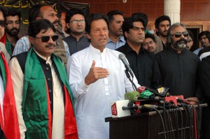 Chairman PTI Imran Khan addressing party workers during membership campaign in Timir village of Islamabad on Sunday. - SABAH
