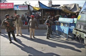 Indian security forces man a road barrier outside an Indian air force base in Pathankot, 430 kilometers (267 miles) north of New Delhi, India, Saturday, Jan. 2, 2016. Gunmen attacked the air force base near the border with Pakistan on Saturday morning and exchanged fire with security forces, officials said. 