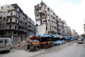 Stalls are seen on a street beside damaged buildings in the rebel held al-Shaar neighborhood of Aleppo, Syria, February 10, 2016