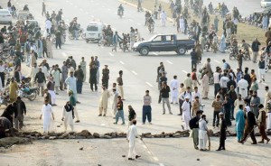 Protestors holding demonstration by blocking Islamabad Expressway  against the execution  of Mumtaz Qadri on Monday. - DNA
