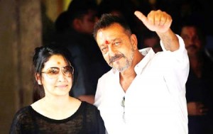 SANJAY DUTT SHOWS A THUMBS UP SIGN ALONG  WITH HIS WIFE MAANYATA AT HIS RESIDENCE IN MUMBAI. 
