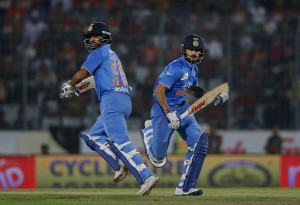 Indias Virat Kohli, right, and Shikhar Dhawan run between the wickets during the Asia Cup Twenty20 international cricket final match against Bangladesh in Dhaka, Bangladesh, Sunday, March 6, 2016. (AP Photo/ A.M. Ahad)