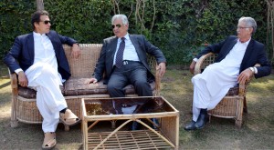 Governor KP Iqabl Zafar Jhagra talking to Imran Khan, Chairman PTI at Governor House in Peshawar on Tuesday. CM KP Pervez Khattak is also present.