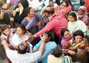 Pakistani Christians mourn the death of a blast victim of the March 27 suicide bombing, in Lahore on March 28, 2016. Pakistan's army launched raids and arrested suspects after a Taliban suicide bomber targeting Christians over Easter killed 72 people including many children in a park crowded with families. / AFP / ARIF ALI        (Photo credit should read ARIF ALI/AFP/Getty Images)