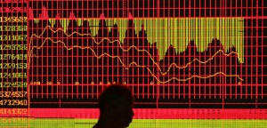NANJING, CHINA - MAY 30: (CHINA OUT)  An investor views the stock index at a securities company on May 30, 2007 in Nanjing, China. The Shanghai Composite Index fell by 6.5% today, after stamp duty on share trading was tripled from 0.1% to 0.3% in a bid by Beijing to cool the nation's recent boom in share prices. The new tax measure has had an immediate psychological impact on investors, many of whom have chosen to lock in their profits.  (Photo by China Photos/Getty Images)