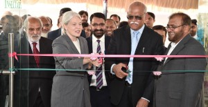 Jocelyn G. Brown Hall, USDA and R. Nadeem Amjad, Chairman PARC are jointly cutting a  ribbon to inaugurate Insectary Biocontrol Container Laboratories at NARC Islamabad  established under USAID and RADP financial support.