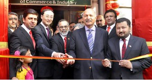 Chinese Ambassador Sun Weidong along with Senator Mushahid Hussain and others cuts the ribbon to inaugurate China Week arranged by RCCI. - DNA