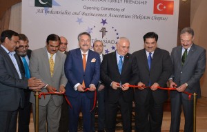Turkish Economy Minister Mustafa Elitas along with Pakistan’s Commerce Minister Khurram Dastagir cutting a ribbon to inaugurate All Industrial and Businessmen Association, in Islamabad on Tuesday. 