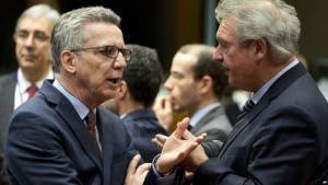 German Interior Minister, Thomas de Maiziere (Left) talking to Luxembourg's Foreign Minister, Jean Asselborn (Right) during a meeting of EU Justice Ministers at the EU Council building in Brussels on Thursday.