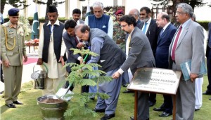 President Mamnoon Hussain planting a sapling at the lawns of the Aiwan-e-Sadr to kick off the annual spring tree plantation campaign on Friday.