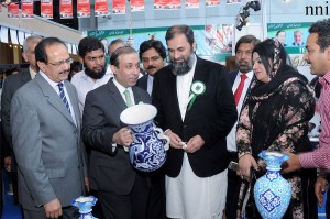 Chairman Toyota, Irfan Qaisar Shaikh showing items prepared by the artisans to Minister of  State for Education, Balighur Rehman at “National Artisans Mela” in Lahore on Wednesday.-NNI