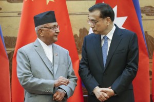 Chinese Prime Minister Li Keqiang talking to his Nepalese counterpart Khadga Prasad Sharma Oli during a  ceremony of singing of agreements between the two countries in Beijing.-AFP