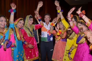 Indian Sikh women staging traditional 'Bhangra Dance' to welcome the Australian former Parliament member Patrick Farmer in Amritsar.-AFP