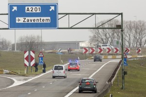 The vehicles are stopped on a road leading to Brussels Airport in the wake of  two bomb blasts there on Tuesday.-AFP