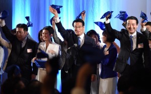 Opposition Democratic Party leader, Katsuya Okada and members of the party waving  handkerchiefs during inaugural ceremony of the party in Tokyo. 