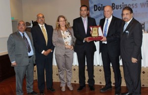 Atif Ikram Shaikh President ICCI presenting shield to Rauli Suikkanen roving Ambassador of Finaland during a seminar on Tuesday.