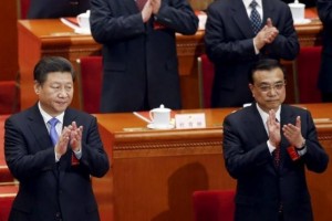 China's President Xi Jinping and Premier Li Keqiang clap during the closing session of the National People's Congress (NPC) at the Great Hall of the People in Beijing, China.