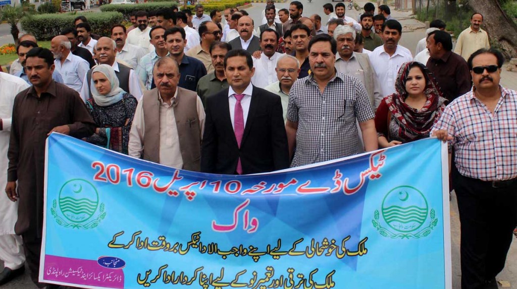 Director Excise and Taxation, Tanvir Abbas Gondal and ETO are leading a walk held to mark Tax Day in Rawalpindi on Sunday.