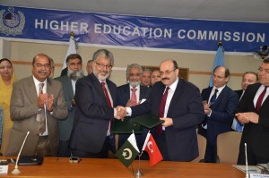 Dr. M A Yekta Sarac, President, Council of Higher Education, Turkey and Dr. Mukhtar Ahmed, Chairman, Higher Education Commission exchanging documents after signing of MoU at HEC Secretariat on Thursday