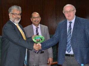 Prof. Arkady Shklyar, Rector, Republican Institute for Vocational Education (RIVE) of Belarus presenting a souvenir to Dr. Mukhtar Ahmed, Chairman HEC. Dr. Arshad Ali, Executive Director HEC is also present.
