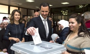 Syrian President Bashar al-Assad casting his vote in parliamentary elections in Damascus on Wednesday.-AP