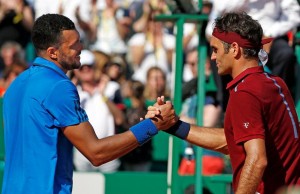 Jo-Wilfried Tsonga of France (L) shakes hand with Roger Federer of Switzerland following their match during Monte Carlo Masters in Monaco. - REUTERS