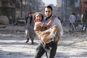 A man carries a wounded girl following a reported bombardment with explosive-packed "barrel bombs" by Syrian government forces in the Al-Mowasalat neighborhood in the northern Syrian city of Aleppo on April 27, 2014. Aleppo is divided between government and opposition control, and clashes on the ground, rebel fire and regime aerial bombardment have all increased there in recent weeks. AFP PHOTO / AMC / FADI AL-HALABI        (Photo credit should read Fadi al-Halabi/AFP/Getty Images)