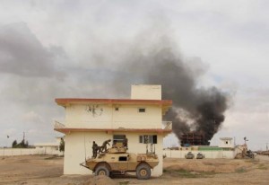 Smoke billows from a building after a Taliban attack in Gereshk district of Helmand province, Afghanistan March 9, 2016.