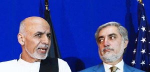 Afghan presidential candidate Ashraf Ghani (L) speaks as opponent Abdullah Abdullah looks on during a joint press conference with US Secretary of State John Kerry (unseen) at the United Nations Compound in Kabul on August 8, 2014. Afghanistan's feuding presidential candidates signed a deal August 8 to form a national unity government, opening an apparent way forward in a dispute over the fraud-tainted election that threatens to revive ethnic conflict. AFP PHOTO/Wakil Kohsar        (Photo credit should read WAKIL KOHSAR/AFP/Getty Images)
