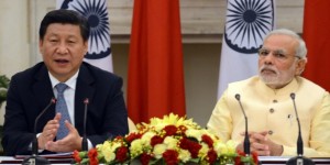 Chinese President Xi Jinping (L) speaks as Indian Prime Minister Narendra Modi looks on as they issue a joint statement in New Delhi on September 18, 2014. India's prime minister expressed concern to China's visiting President Xi Jinping September 18 about "incidents" on the two countries' disputed border, as a stand-off between troops at the frontier overshadowed key talks. "I expressed concern on the incidents on the border and said peace and tranquility on the border is the foundation for good relations," said Prime Minister Narendra Modi after formal talks with the Chinese leader. AFP PHOTO/RAVEENDRAN        (Photo credit should read RAVEENDRAN/AFP/Getty Images)