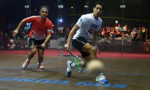 Egypt's squash player Tarek Momen (R) follows the ball as his opponent Pakistani player Farhan Mehboob looks on during their two-day bilateral series between Pakistan and Egypt — AFP
