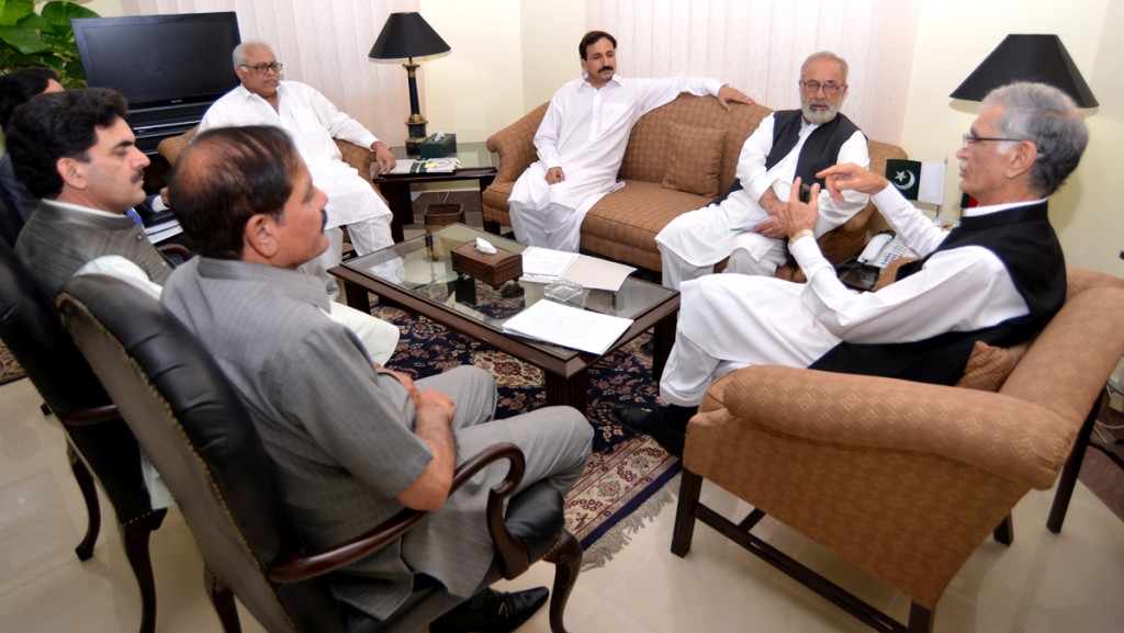 CM KP Pervez Khattak talking to Ajmal Khan, Vice Chancellor Islamia College University  in Peshawar on Wednesday.