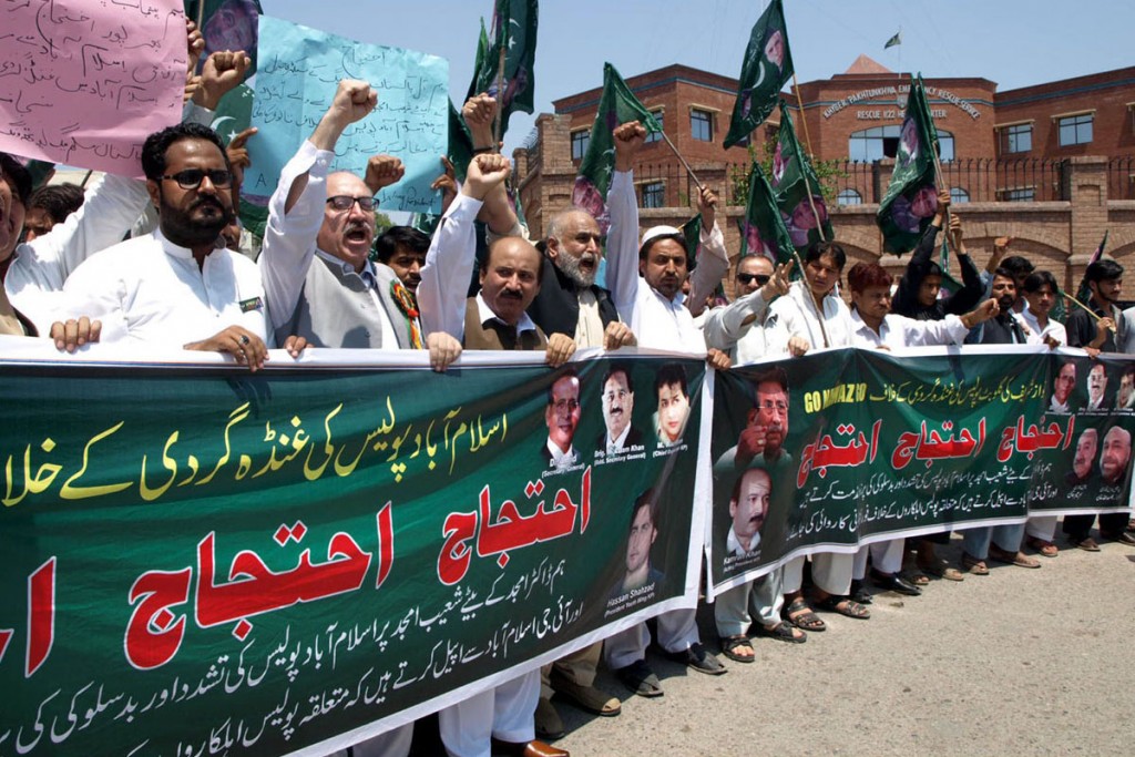 Activists of PML-Q protesting in favour of their demands outside of Peshawar Press Club in Peshawar on Thursday. - DNA