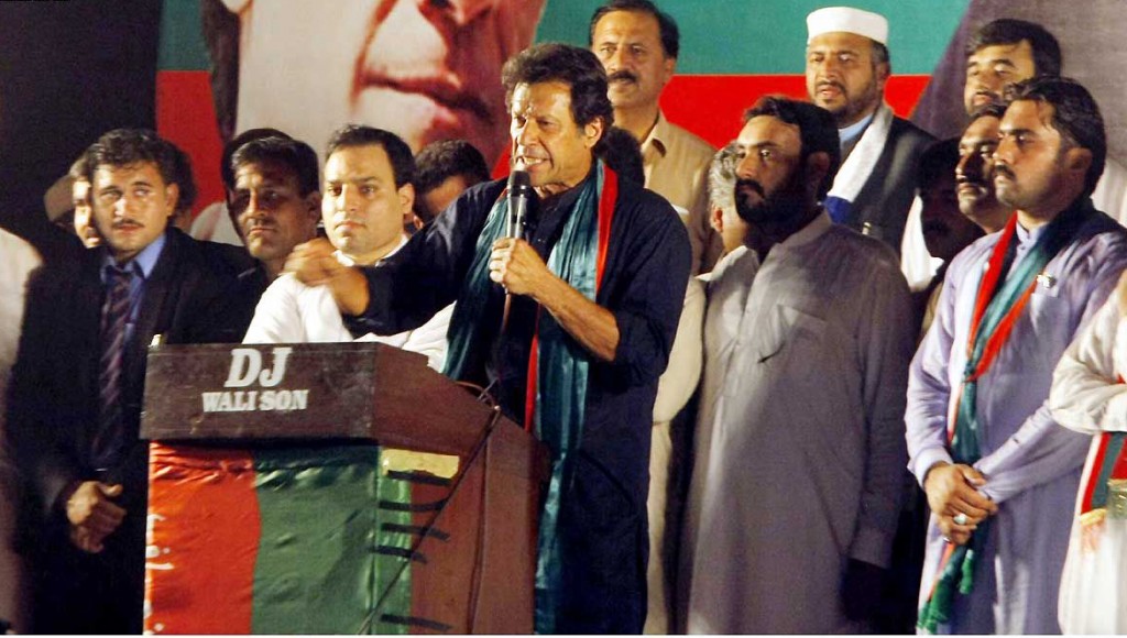 PTI Chairman Imran Khan addressing party workers at PTI congregation in Peshawar on Monday. - DNA