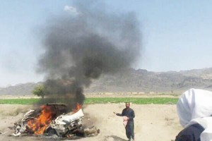 This photograph taken on May 21, 2016 shows Pakistani local residents gathering around a destroyed vehicle hit by a drone strike in which Afghan Taliban Chief Mullah Akhtar Mansour was believed to be travelling in the remote town of Ahmad Wal in Balochistan, around 160 kilometres west of Quetta. Afghan authorities scrambled May 22 to confirm the fate of Taliban leader Mullah Akhtar Mansour after US officials said he was likely killed in drone strikes -- a potential blow to the resurgent militant movement.  / AFP PHOTO / -