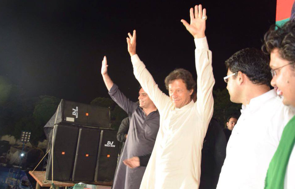 Chairman PTI Imran Khan responding to workers’ slogans in Jhelum Stadium on Wednesday.