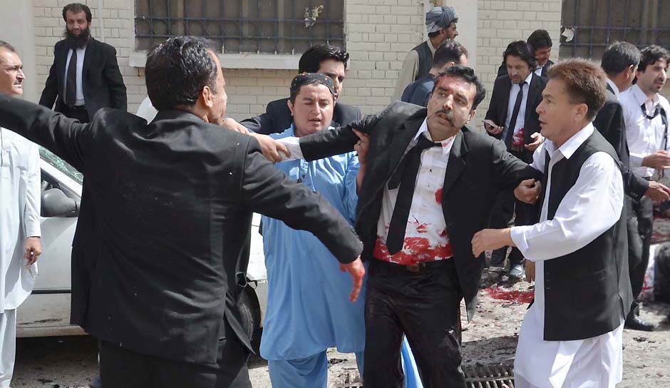 An injured lawyer being taken to emergency unity for first aid after suicide attack in Civil Hospital in Quetta on Monday. - NNI