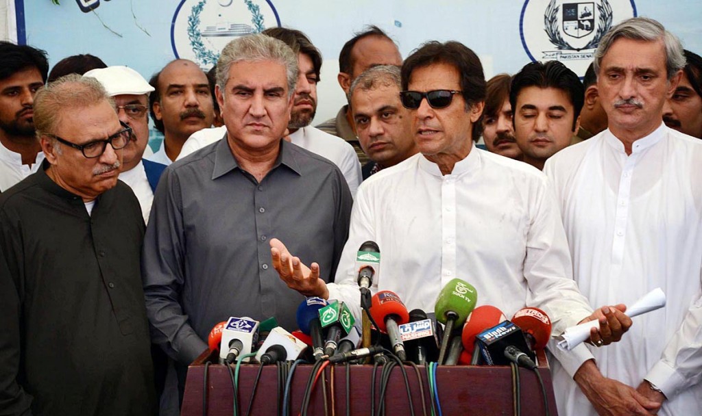 Chairman PTI Imran Khan along with Shah Mehmood Qureshi and Jahangir Tareen talking to mediamen outside of Parliament House after the session of National Assembly on Thursday. - Online