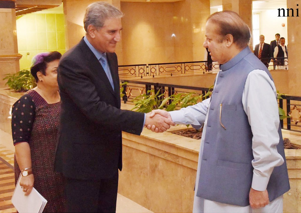 Prime Minister Muhammad Nawaz Sharif receiving PTI Central leader Shah Mehmood Qureshi for All Parties Conference in Islamabad on Monday. - NNI