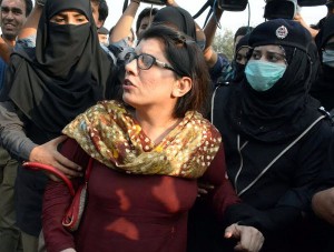 Lady police arresting PTI woman worker in Islamabad on Monday. - SABAH