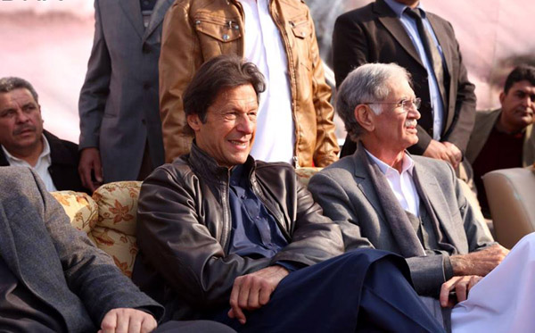 SAWABI, DEC 25: PTI Chairman, Imran Khan sitting on stage before addressing the party workers of Swabi, on Sunday. =DNA PHOTO