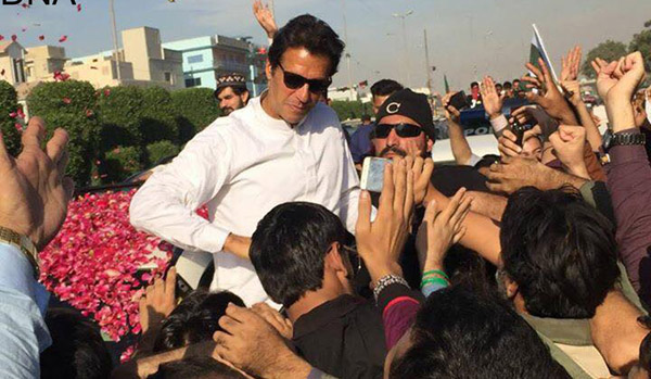 Chairman PTI Imran Khan being welcomed by his supporters during his visit to Karachi. - DNA