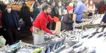 A fishmonger works at a market in Ankara, Turkey